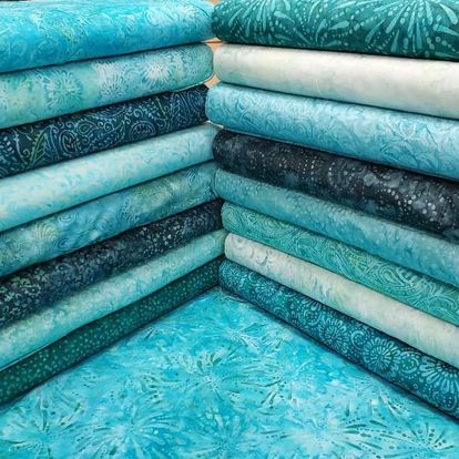 Hand dyed Batiks are known for their mottled, rich colors and prints.  Affinity For Quilts carries a wide variety of Batiks from a variety of vendors.